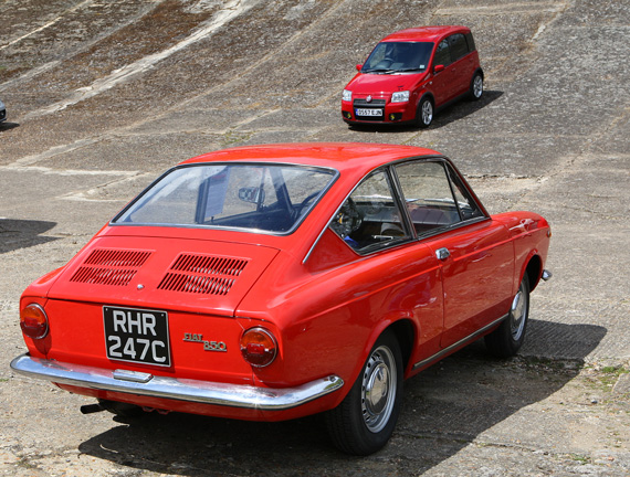 This 1965 Fiat 850 Coupe benefited from spending the first 50 years of her life enjoying Italian Sunshine. Behind on the banking is a rather more recent baby performance Fiat, namely a 100 HP Panda.To the left of the shot is an even quicker Fiat, or should I say 500 Abarth.